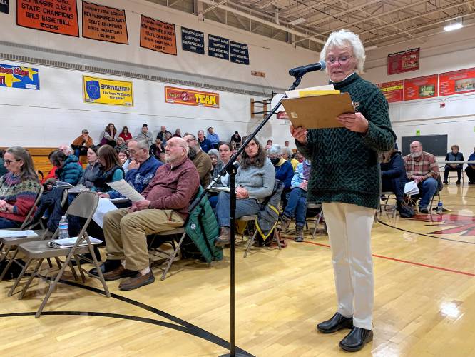 Rindge resident Roberta Oeser offers an amendment to the district budget, cutting it by $500,000, which was defeated.