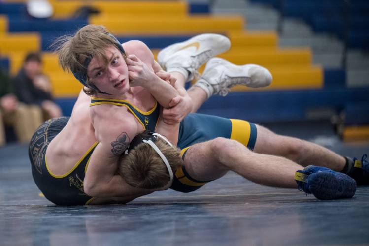 ConVal junior Jonathan Henley looks over for some coaching as he controls his Souhegan opponent. 