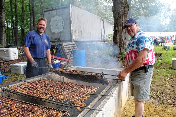 Randy Wayrynen and Pete Bergeron man the chicken barbeque pit.