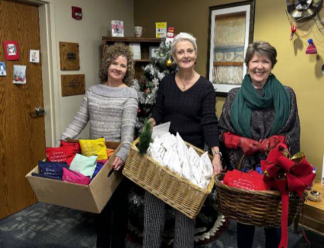 From left, Denise Chatel, Ellen Smith and Ruth Clark smile bright as they donate gift bags for oncology patients at Monadnock Community Hospital.