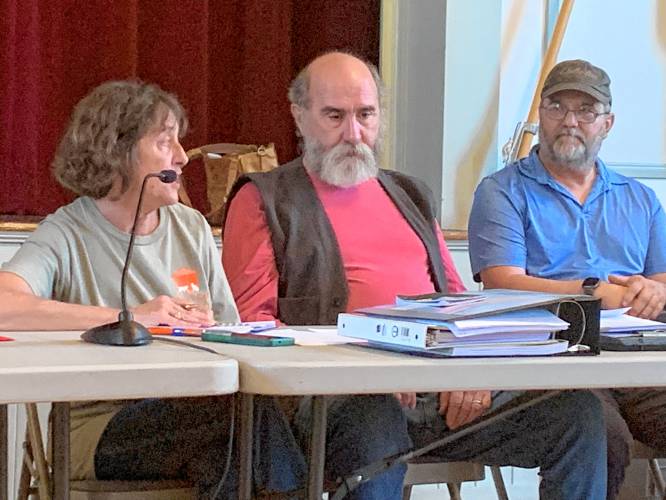 Temple Zoning Board Chair Deborah Harling, member Allan Pickering and alternate Jim Medeiros review a request for a rehearing submitted by Alan Marsh and John Jackson-Marsh for a special exception to allow a collection of antique construction equipment on their West Road property.